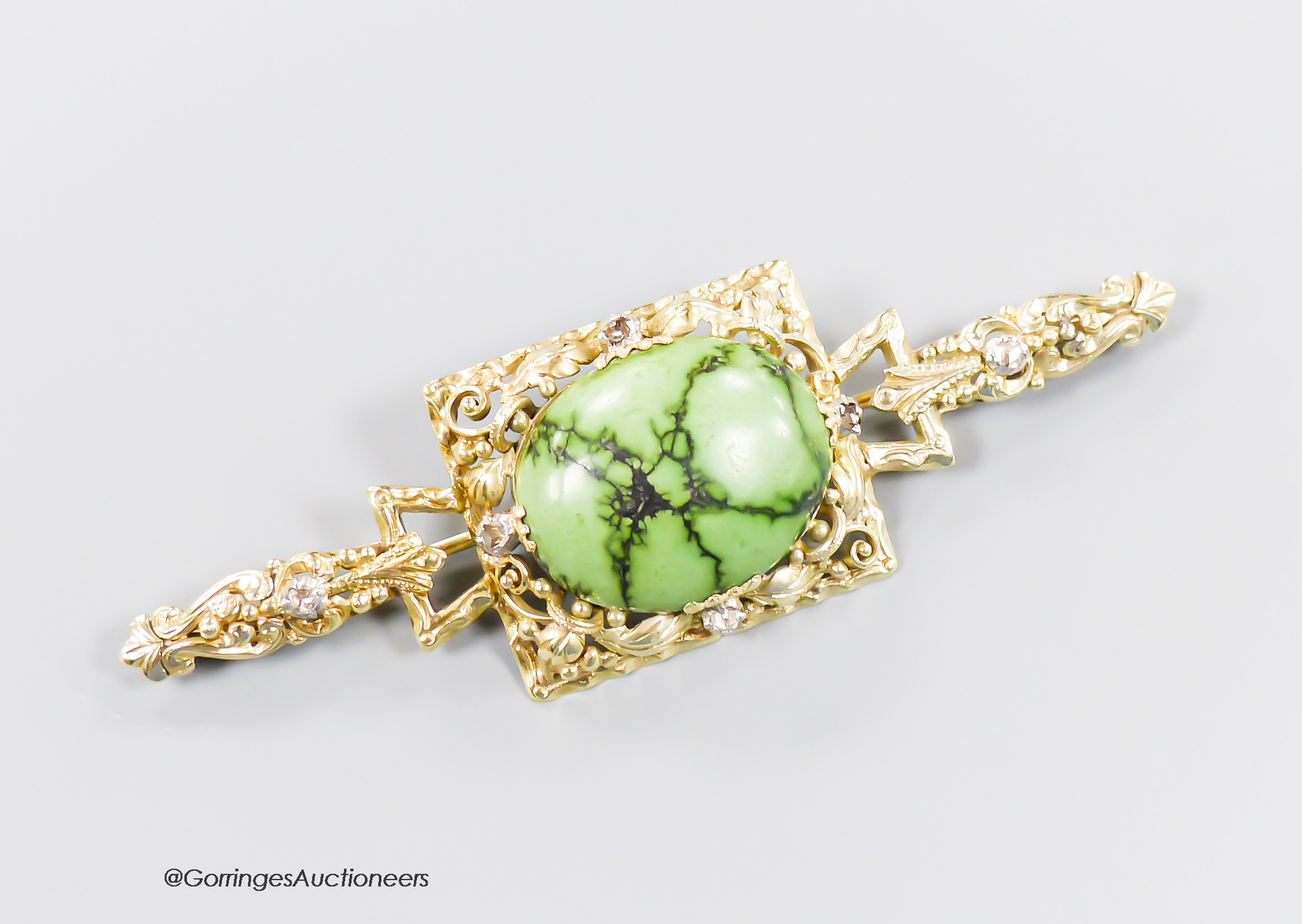 A modern 9ct gold, cabochon turquoise and four stone rose cut diamond chip set bar brooch, 67mm, 9.5 grams.